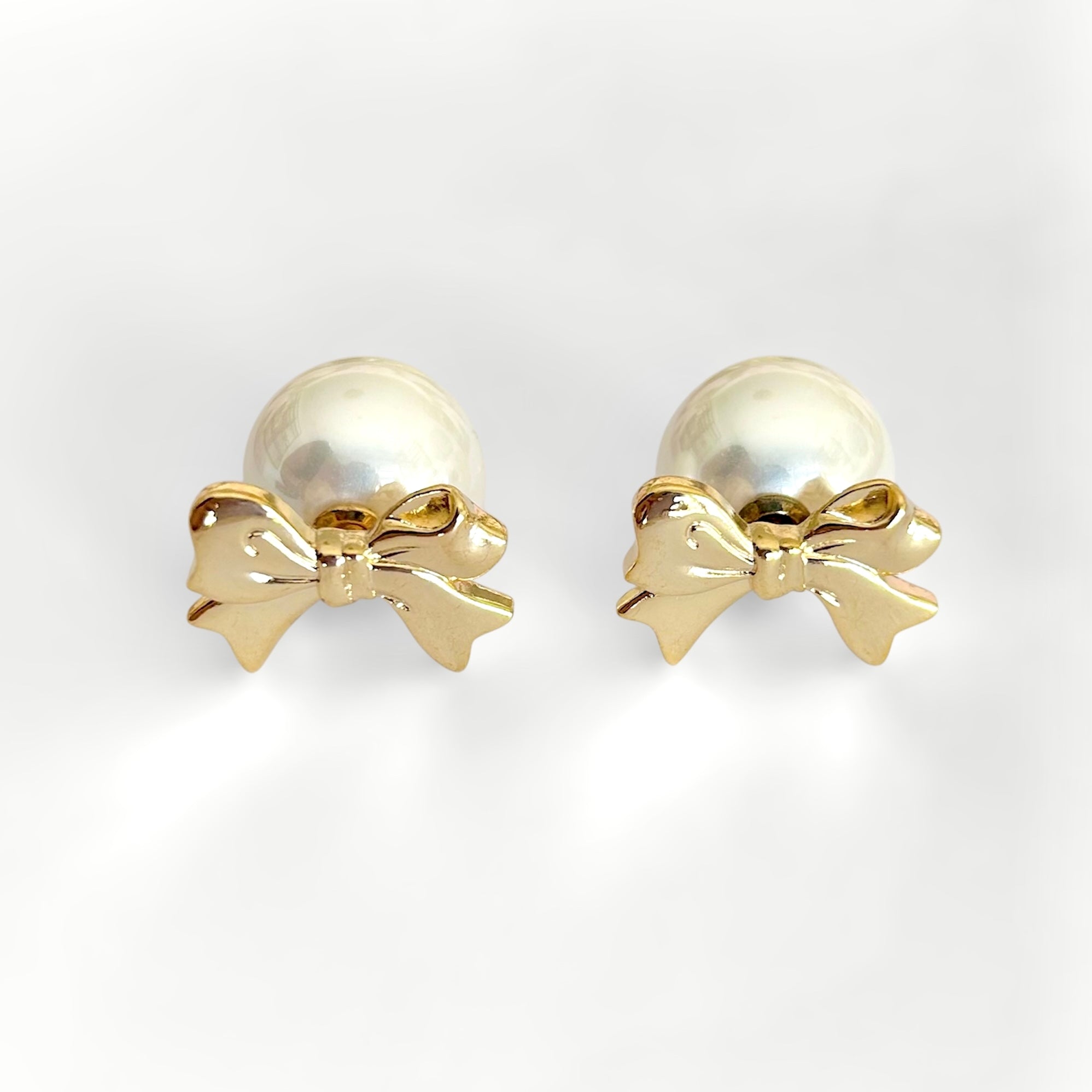 Aretes moño con perla