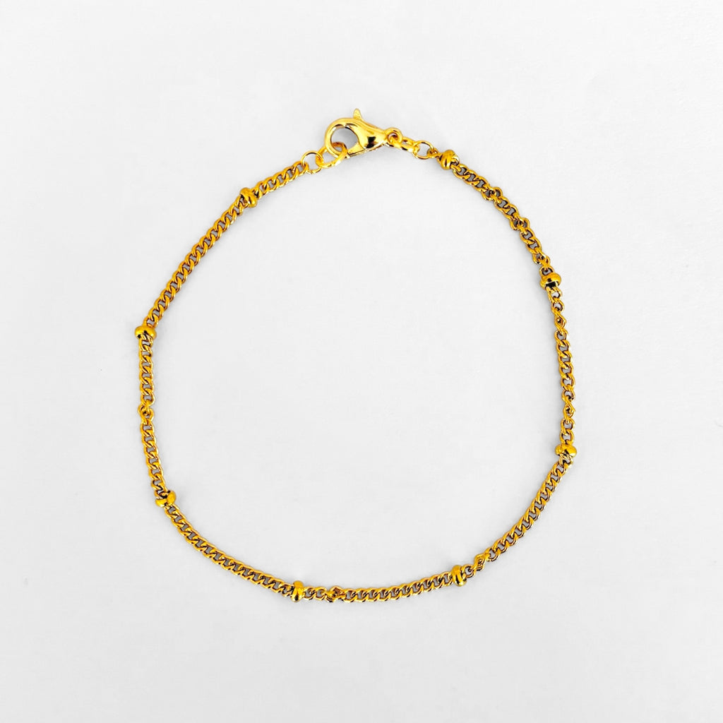 Pulsera sencilla bolitas doradas
