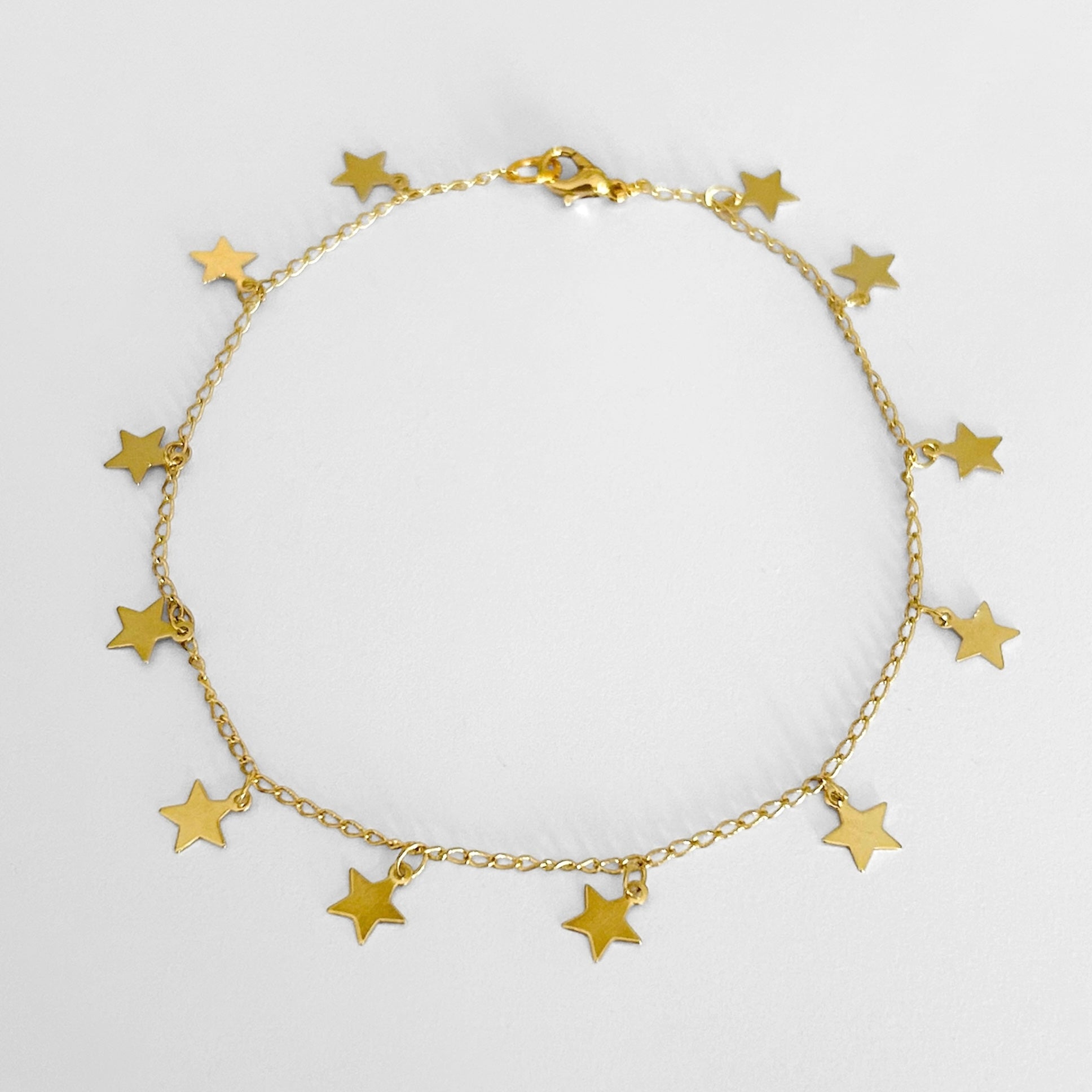 Tobillera estrellas doradas