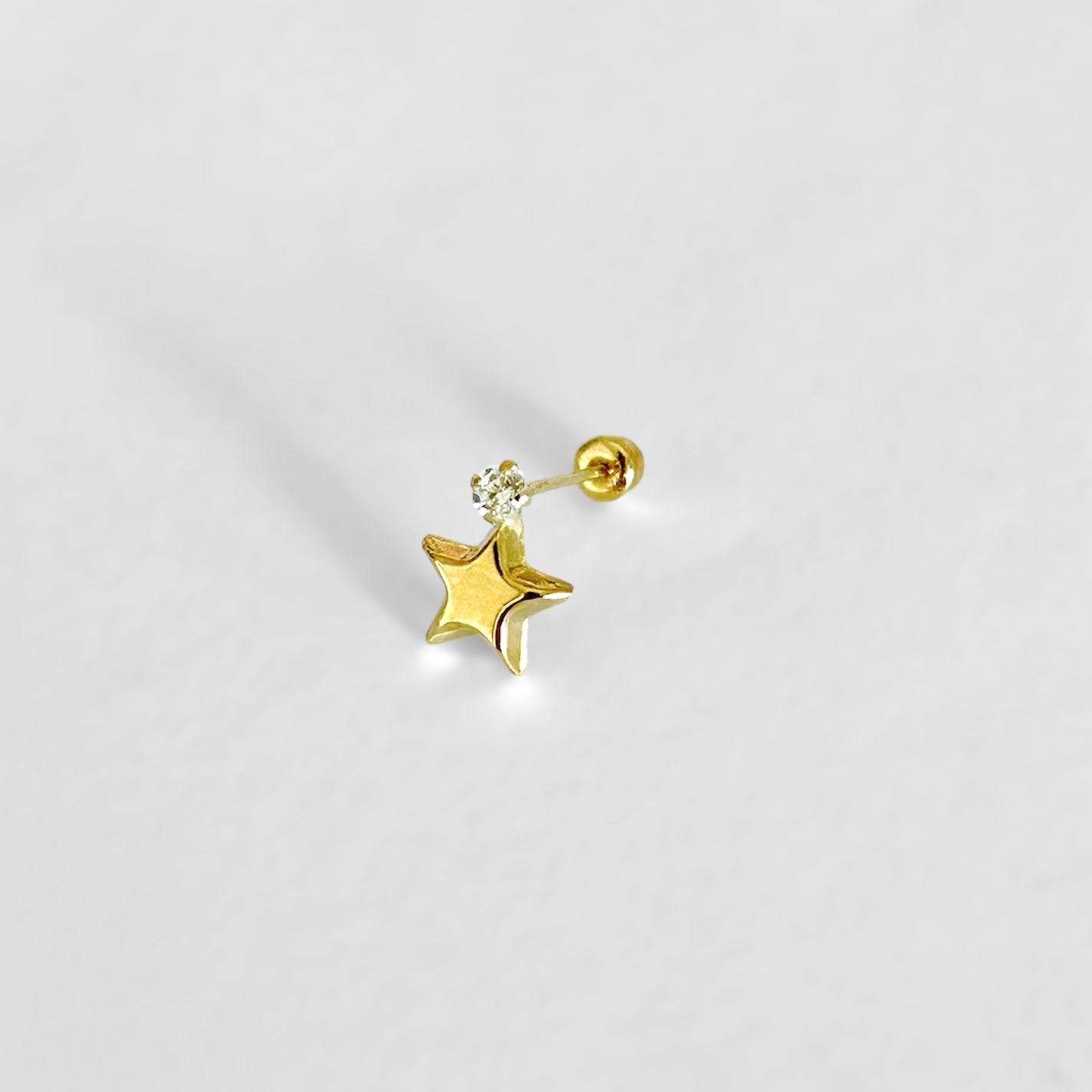 Piercing zirc estrella colgando ORO10K