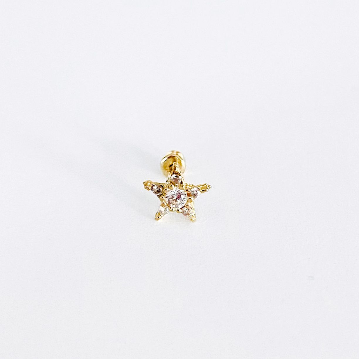 Piercing estrella zirconia oro 10k